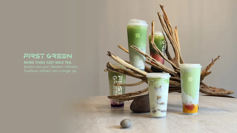 Five FirstGreen matcha drinks on driftwood